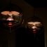 Stylish spherical pendant lights casting warm glow in a dim indoor setting.