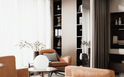 Elegant interior with an armchair, round lamp, and filled bookshelves.