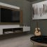 Stylish living room setup featuring a mounted TV, acoustic guitar, abstract art, and modern furniture design.