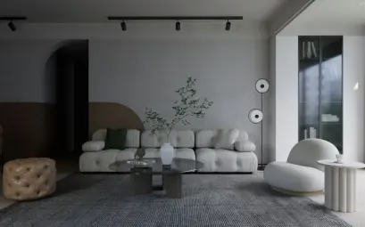 a living room with a couch, chair, table and speakers