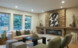 Cozy living room with stone fireplace and modern furniture
