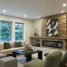 Cozy living room with stone fireplace and modern furniture